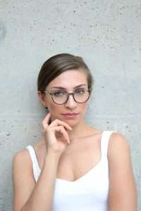 girl in eyeglasses - eye help device